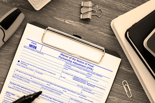  Financial concept meaning Form 14726 Waiver of the Notice of Final Partnership Adjustment (FPA) with sign on the sheet.