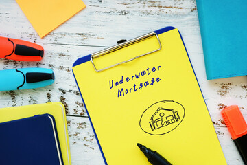 Business concept meaning Underwater Mortgage with inscription on the sheet.