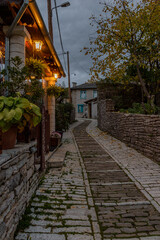 Fototapeta na wymiar Traditional architecture with narrow street and stone buildings a in Monodendri village central Zagori Greece