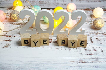 Goodbye 2022 alphabet letters with space copy on wooden background