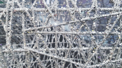 Snow fake made with paper, wire and splash with spray color for decorative on party, festival, event or Christmas celebrated in vintage tone. Silver or white glitter or shining background.