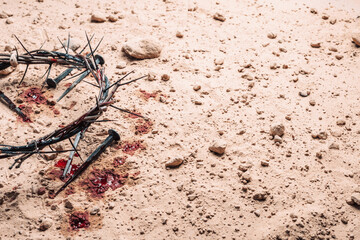 Good Friday, Passion of Jesus Christ. Crown of thorns and bloody nails on ground. Christian Easter...