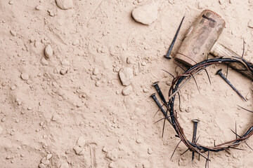 Good Friday, Passion of Jesus Christ. Crown of thorns, hammer, old nails on ground. Christian...