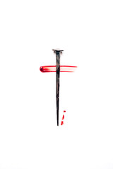 Christian cross made with rusty nails, drops of blood on white background. Copy space. Good Friday, Easter day. Christian backdrop. Biblical faith, gospel, salvation concept. Jesus Christ Crucifixion
