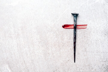Christian cross made with rusty nails, drops of blood on grey background. Copy space. Good Friday, Easter day. Christian backdrop. Biblical faith, gospel, salvation concept. Jesus Christ Crucifixion - obrazy, fototapety, plakaty