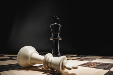 Chess board with figures on dark background