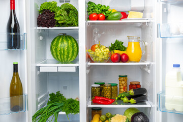 Fridge shelf full of fresh vegetables close up