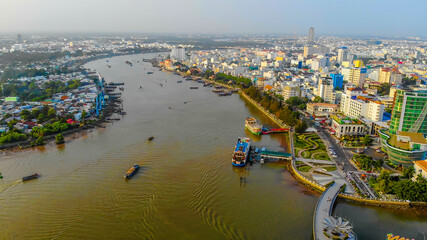 Top view aerial view love bridge or Ninh Kieu quay of downtown in Can Tho City, Vietnam with development buildings, transportation, energy power infrastructure