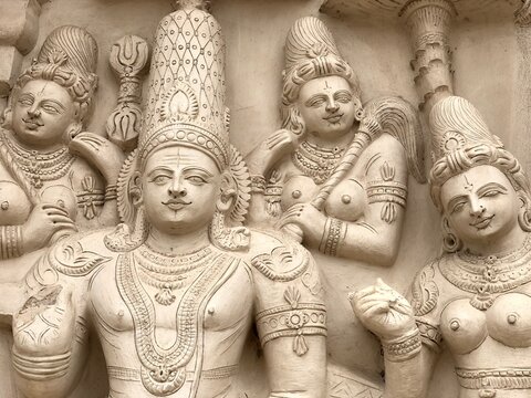 Ancient sandstone carved historical Hindu God sculptures in the temple walls. Carved idols in ancient Kanchi Kailasanathar temple in Kanchipuram, Tamilnadu.