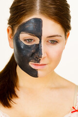 Woman with charcoal facial mask