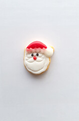 Santa decoration on butter cookies on white background