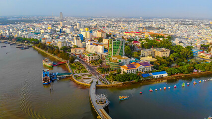 Fototapeta na wymiar Top view aerial view love bridge or Ninh Kieu quay of downtown in Can Tho City, Vietnam with development buildings, transportation, energy power infrastructure