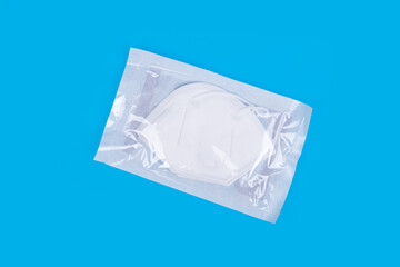 Package of KN95 masks  on light blue background