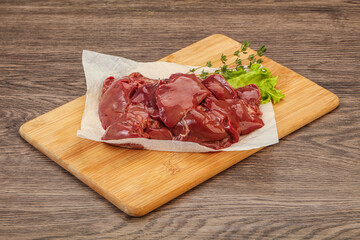 Raw chicken liver over board