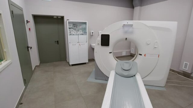 PAN of radiology room with CT scan machine in hospital