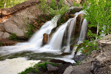 Fototapeta na wymiar Belovsky waterfall in the spring