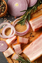 Concept of tasty snack with bacon on wooden board