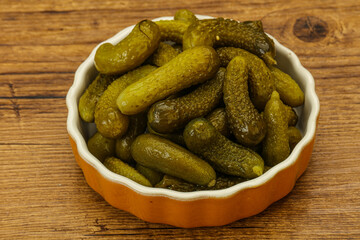 Pickled gherkin in the bowl