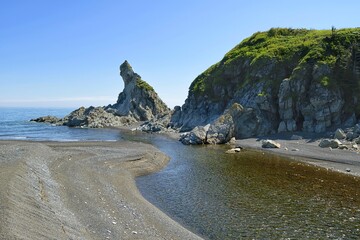 Obraz premium Mountain river mouth. Sea of Okhotsk coast. Khabarovsk Krai, far East, Russia.