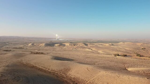 Flying away from the solar power station Ashalim in Negev desert