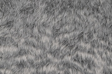 Gray fur texture background, top view of furry cloth pattern