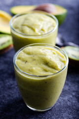 Green smoothie kiwi banana and avocado. Fresh juicy green detox smoothie.