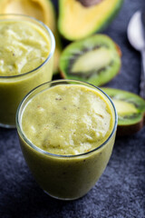 Green smoothie kiwi banana and avocado. Fresh juicy green detox smoothie.