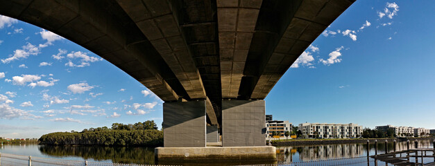 Beautiful underneath view of a road bridge across a river, Wilson park, Sydney, New South Wales, Australia 