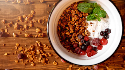 Food photo of fresh and tasty bowl with granola, berries and mint