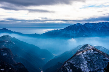 snow-capped alpine peaks in the clouds three