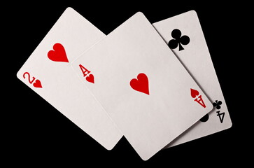 Poker playing cards isolated on black background with clipping path