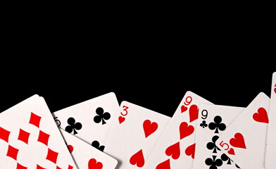 Poker playing cards isolated on black background with clipping path