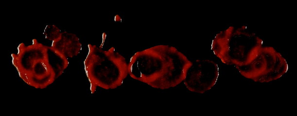 Blood drops, stains isolated on black background with clipping path, top view