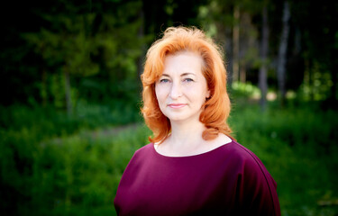 Obraz premium Portrait of Attractive Old woman with ginger hair