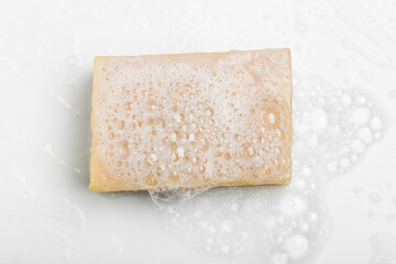 Soap with foam on a white background Soap used in everyday life, including washing, bathing