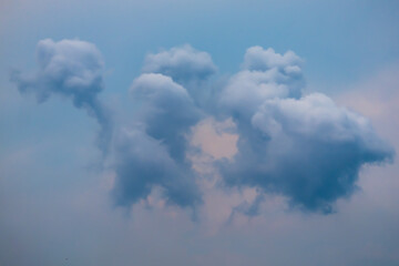Fototapeta premium Bizarre blue clouds in the blue sky