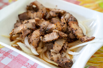 Delicious Taiwanese salted pork food with onion in restaurant.