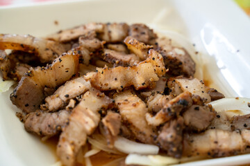 Delicious Taiwanese salted pork food with onion in restaurant.