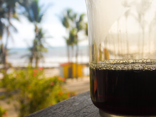 glass of coffe in the beach
