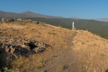 an old statue in the field next to the village of Aldeire