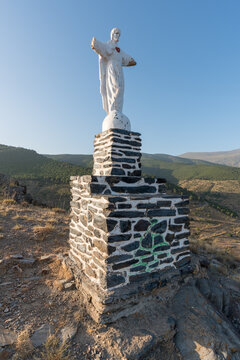 an old statue in the field next to the village of Aldeire