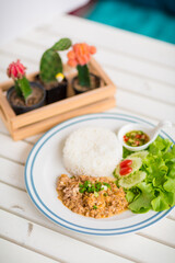 Garlic Pepper Pork Rice with vegetables Serving on table