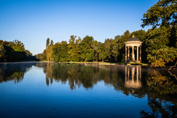 Pavillion reflection at sunrise in a park in Munich, Bavaria, Germany