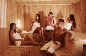 Group of young people together in sauna. Conception of vacation and weekend