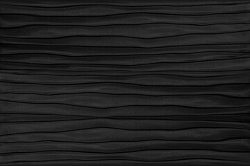 Contemporary carved wavy black leather pattern
