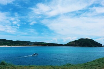 Scenic view of sea and mountain against sky