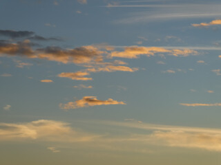 photo of the sky with a beautiful sunrise and golden clouds