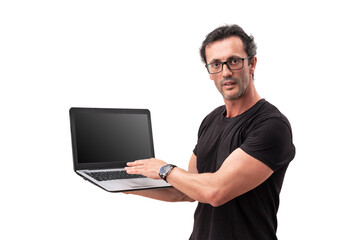 A middle-aged man, on a white background, holds a laptop computer, and makes presentation advertising, for marketing. On a white isolated background.