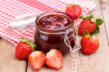 Delicious strawberry jam in a glass jar