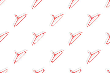 Clothes hanger on a white background. Clothes hangers seamless pattern.